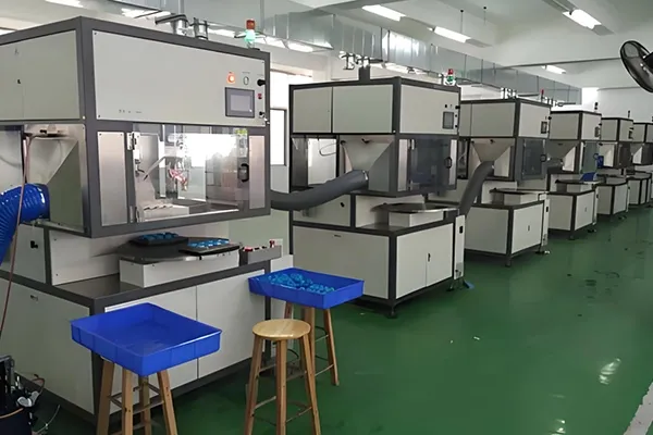 Assembly line for adhesive-backed metal labels