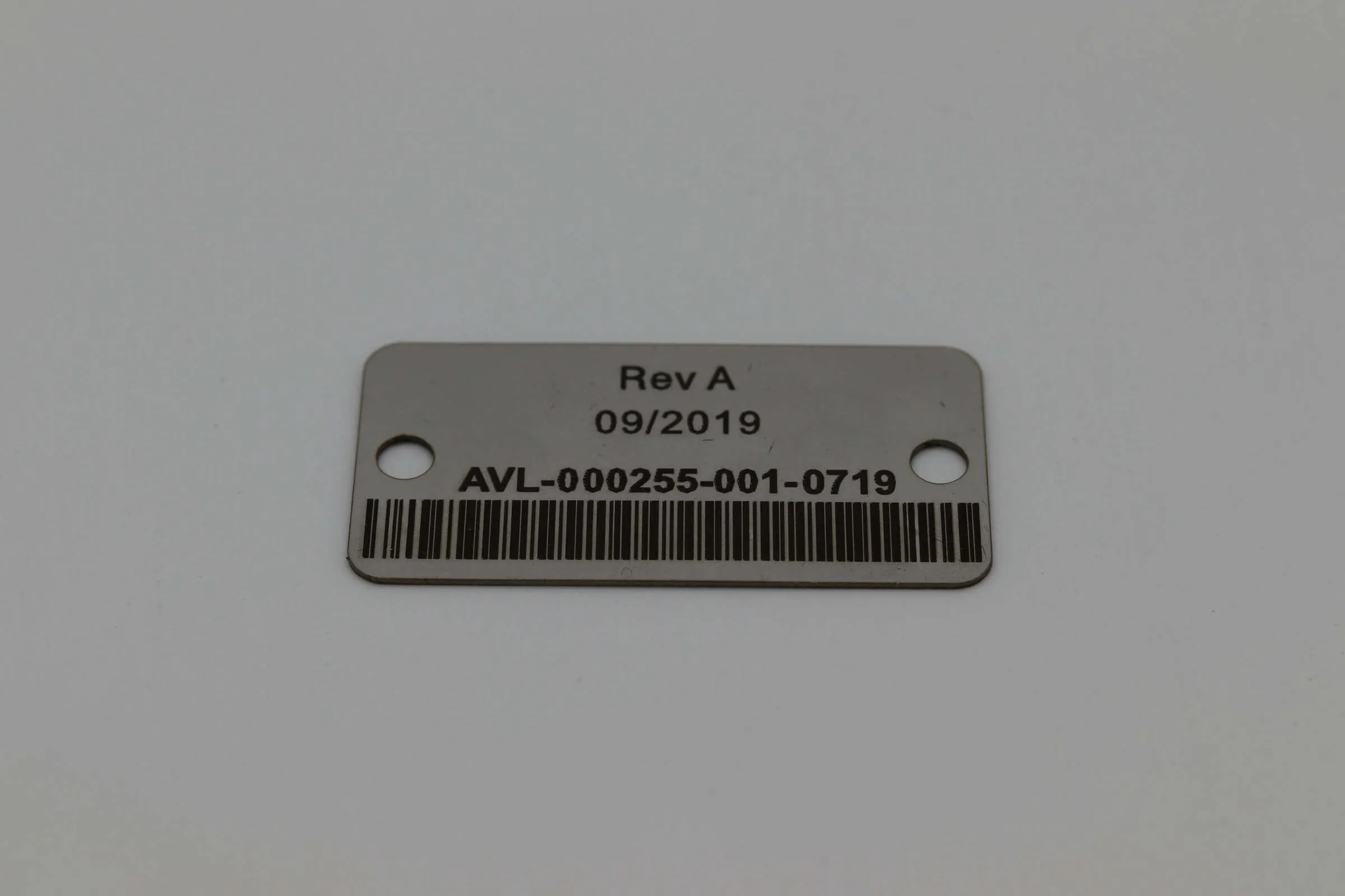 Metal asset tag samples with barcode
