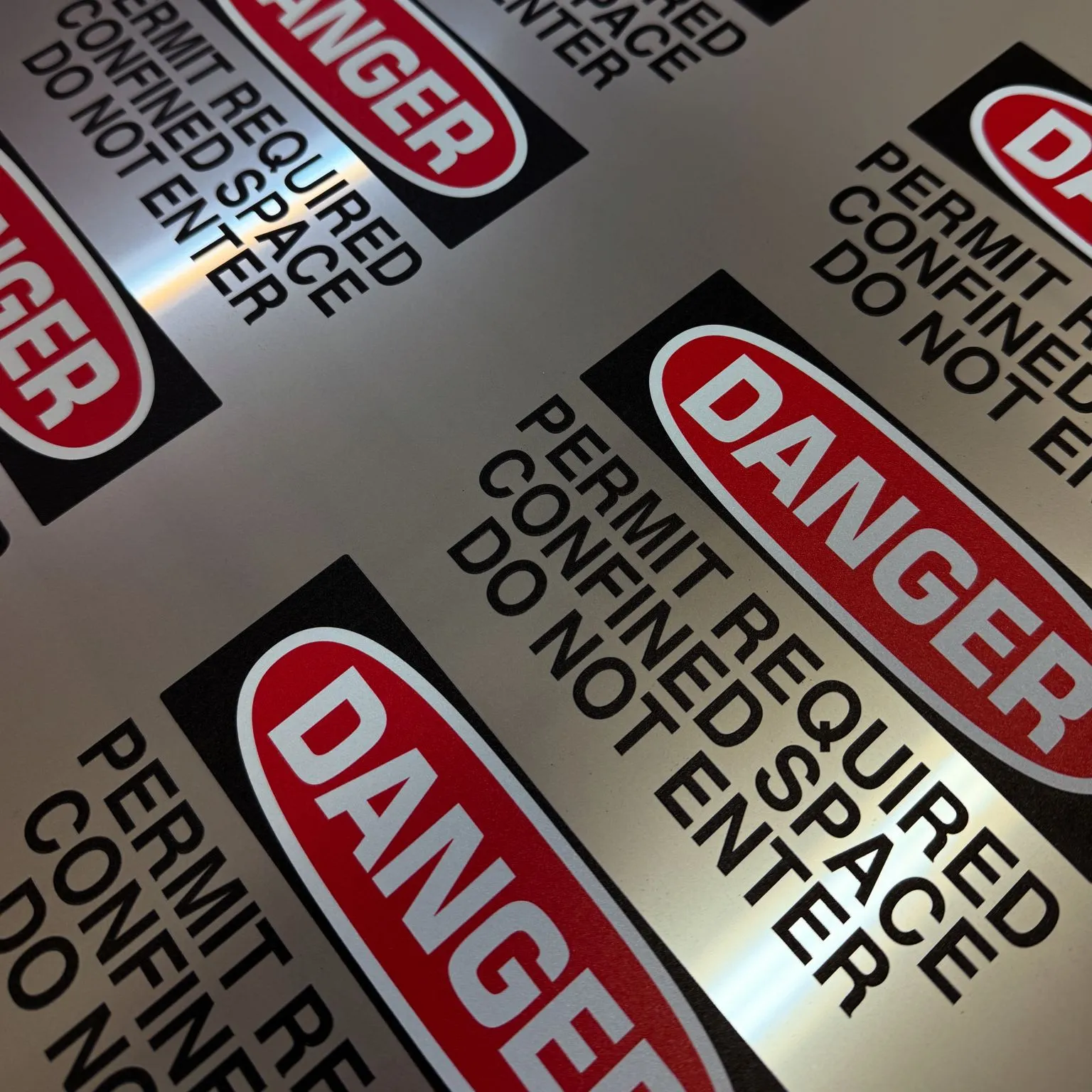 Custom metal nameplate applied on industrial equipment